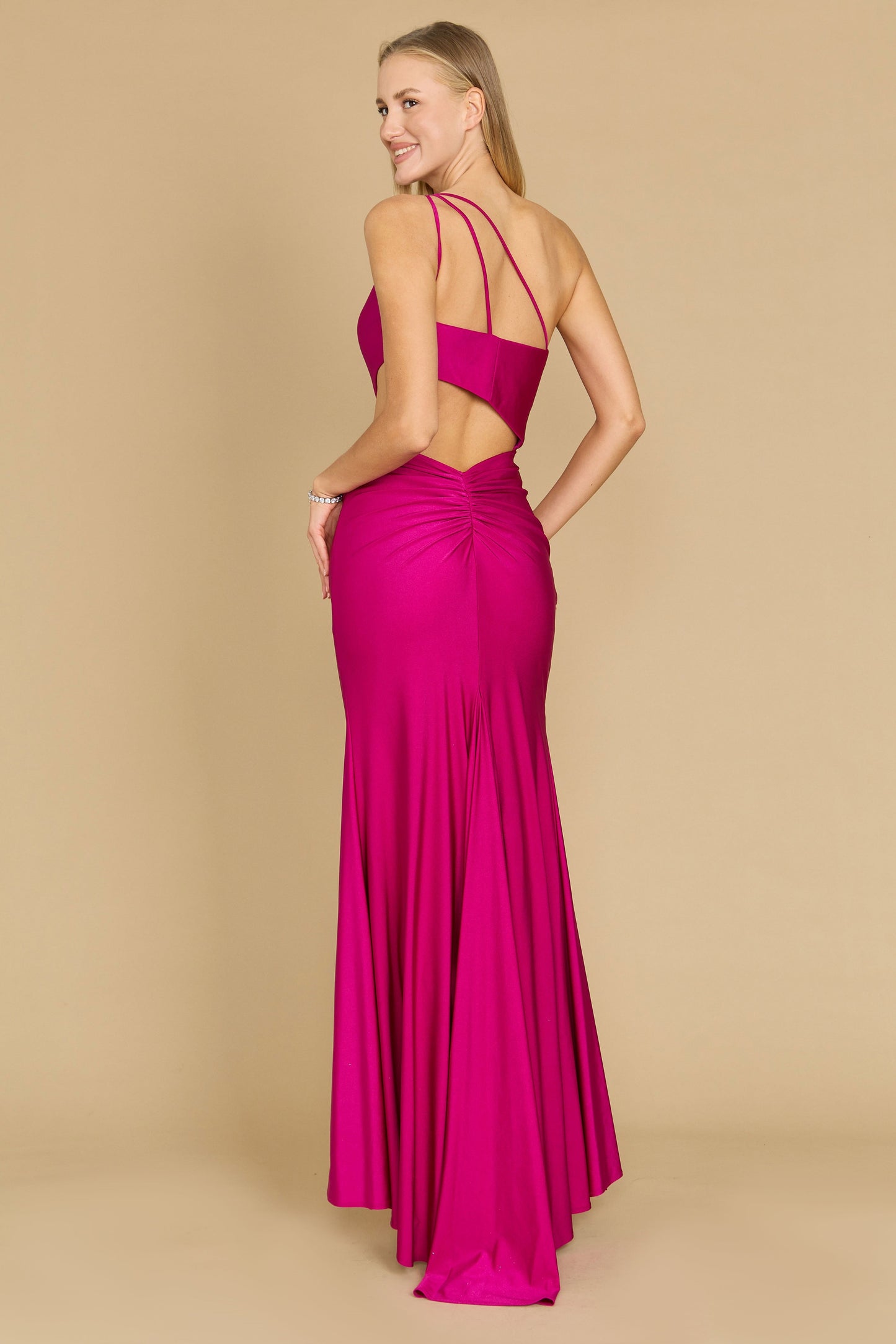 A stunning magenta prom dress featuring elegant side cutouts, designed for a glamorous and sophisticated look.