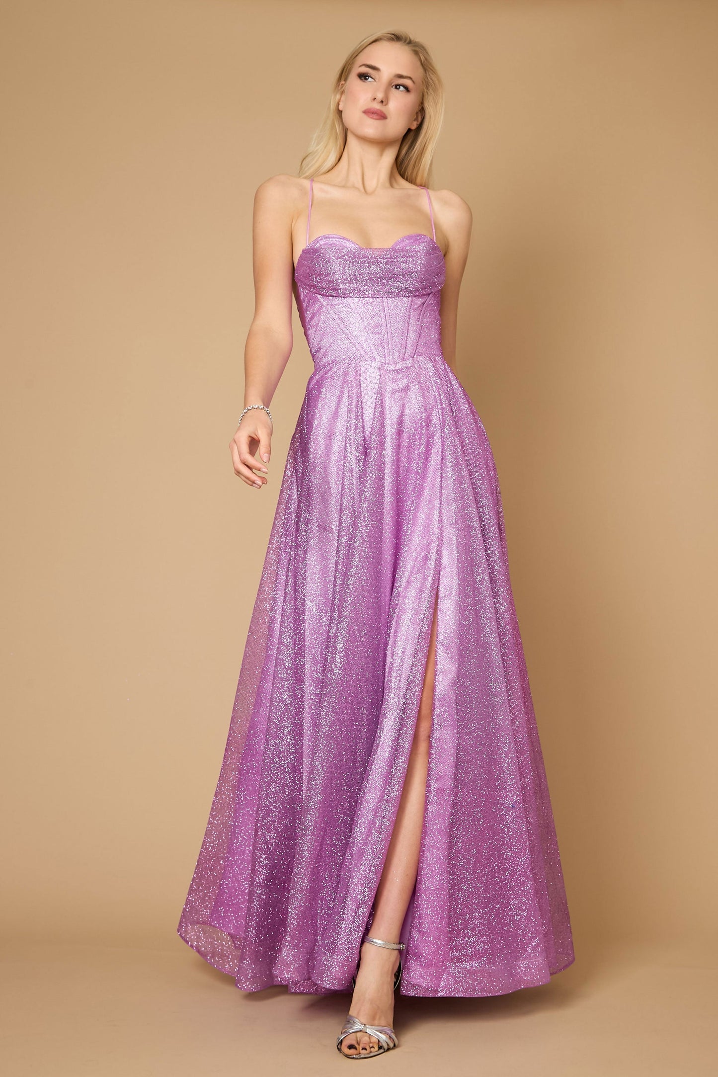A stunning mauve prom dress featuring a long, sparkling cowl neckline and a fitted corset bodice, elegantly flowing into a full skirt that shimmers with every movement.