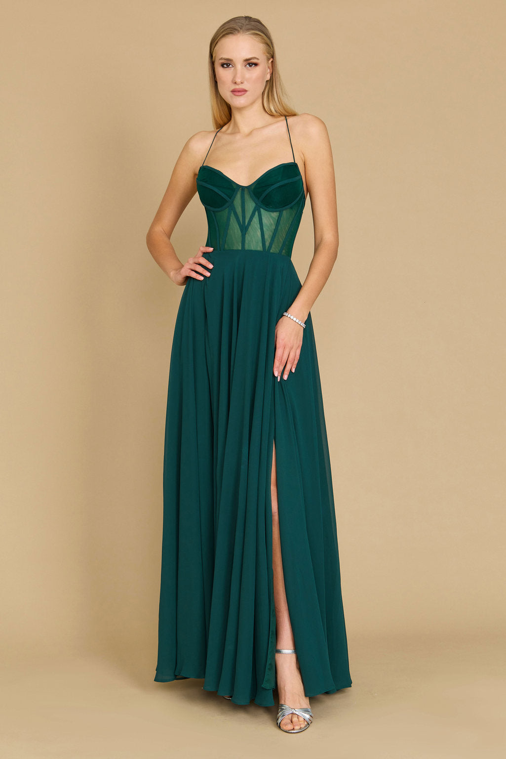 Elegant long chiffon corset formal prom dress in a rich emerald green, featuring a fitted bodice and flowing skirt, perfect for a glamorous evening event.