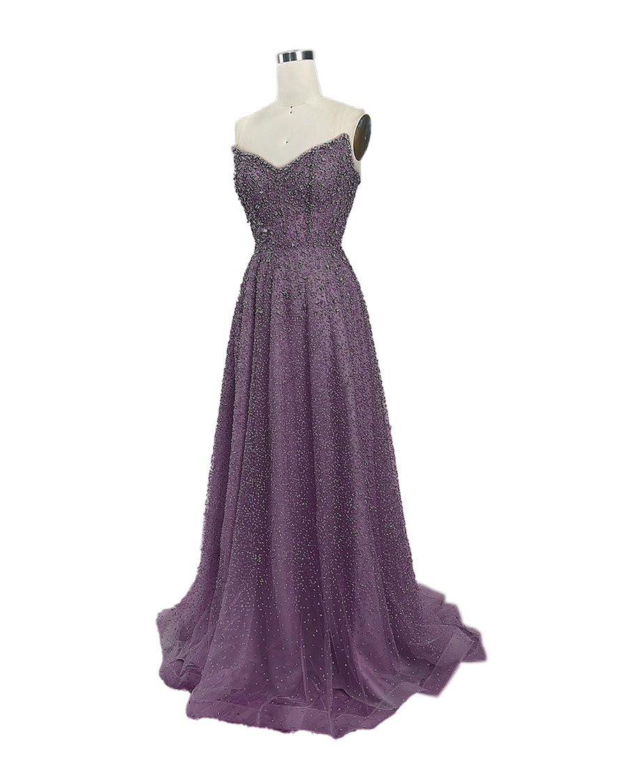 A stunning long strapless formal couture dress adorned with intricate hand-beaded details, showcasing elegance and sophistication.