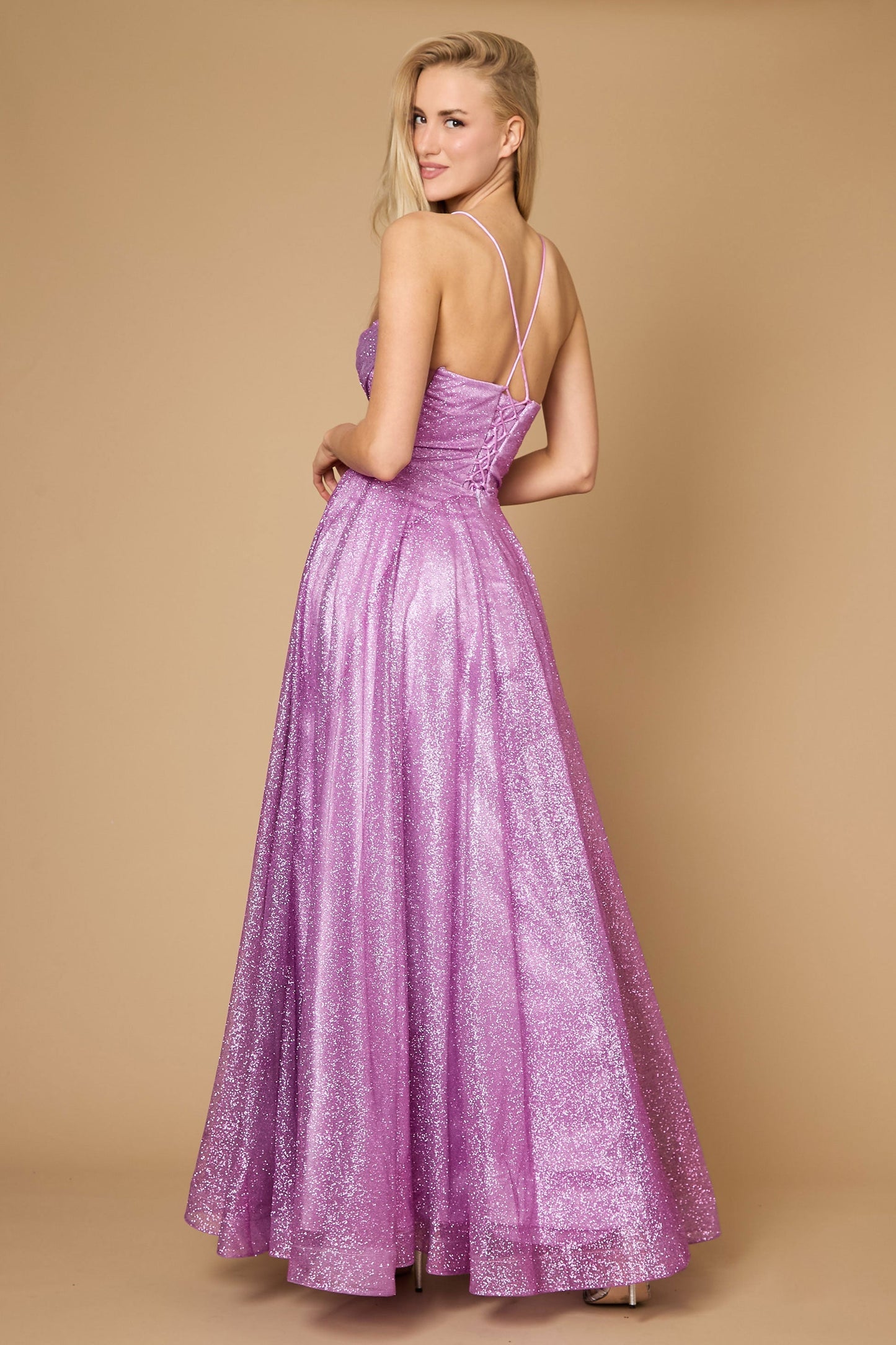 A stunning mauve prom dress featuring a long, sparkling cowl neckline and a fitted corset bodice, elegantly flowing into a full skirt that shimmers with every movement.