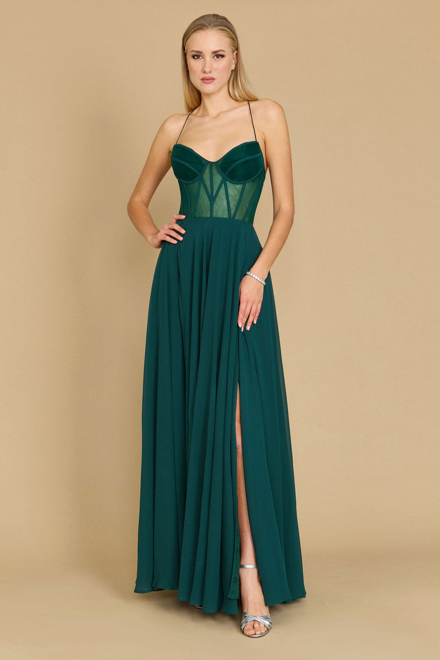 Elegant long chiffon corset formal prom dress in a rich emerald green, featuring a fitted bodice and flowing skirt, perfect for a glamorous evening event.