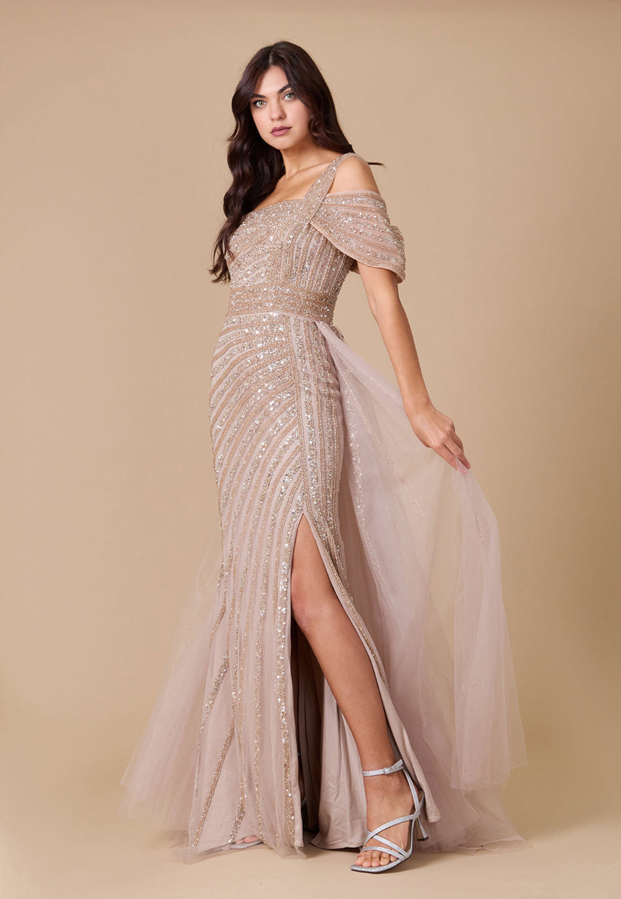 A stunning one-shoulder formal couture dress adorned with intricate hand-beaded details, showcasing elegance and sophistication.