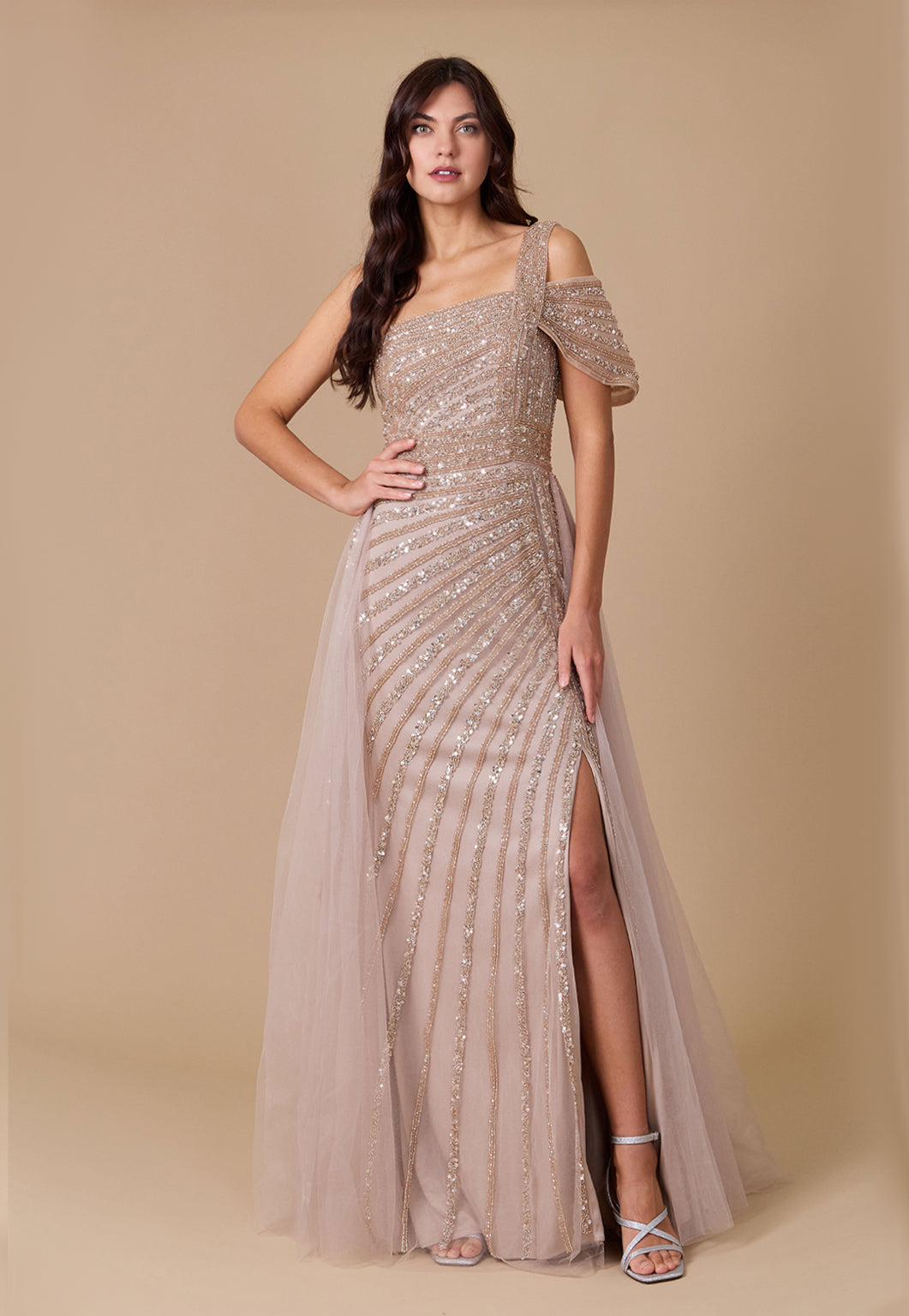 A stunning one-shoulder formal couture dress adorned with intricate hand-beaded details, showcasing elegance and sophistication.