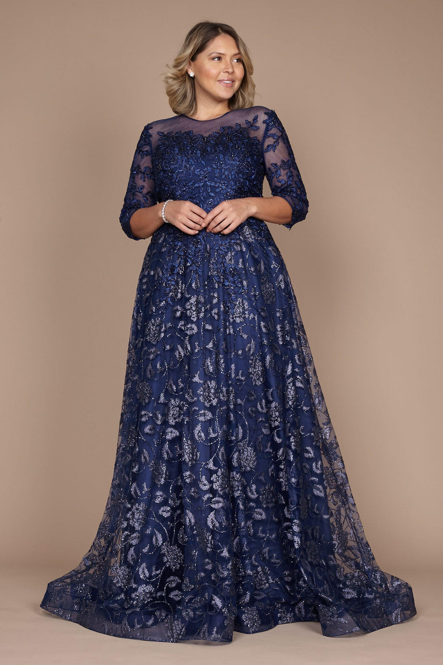 A stunning long formal lace evening dress in navy, featuring intricate lace detailing and a flowing silhouette, perfect for elegant occasions.