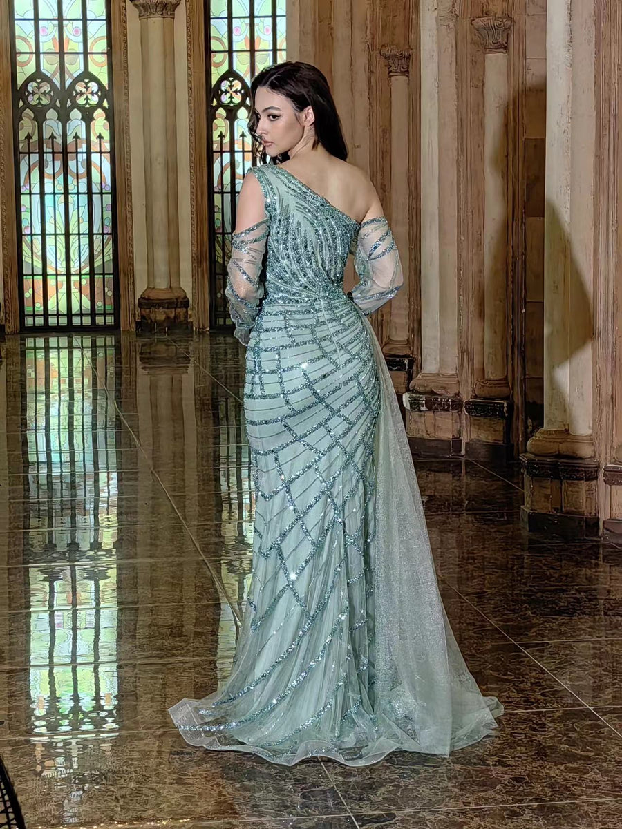 Elegant sage green long couture dress featuring long sleeves and intricate hand-beaded detailing, perfect for formal occasions.